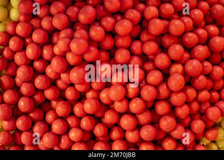 many colored marmalade candies laid out on a flat surface; dessert for the holiday; sweet gifts for children; texture and background with small candie Stock Photo