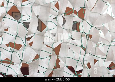 Winter camouflage netting for soldiers of the Ukrainian army Stock Photo