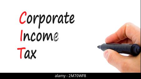 CIT corporate income tax symbol. Concept words CIT corporate income tax on white paper on a beautiful white background. Businessman hand. Business and Stock Photo