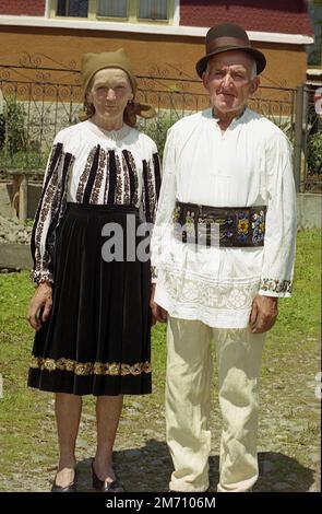 Mures County, Romania, approx. 2001. Elderly couple wearing their traditional handmade garments. Stock Photo