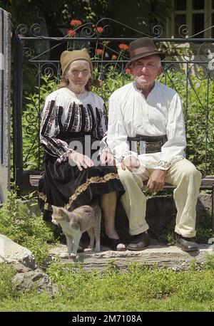 Mures County, Romania, approx. 2001. Elderly couple wearing their traditional handmade garments. Stock Photo