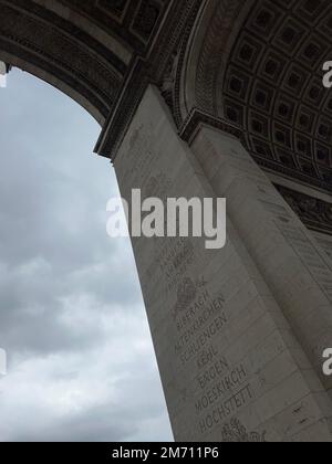 A vertical shot of the solid column of an interior of the Arc de Triomphe in Paris, France Stock Photo