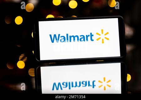 Brazil. 30th Mar, 2022. In this photo illustration, a woman's silhouette  holds a smartphone with the Walmart logo in the background (Photo by Rafael  Henrique/SOPA Images/Sipa USA) Credit: Sipa USA/Alamy Live News Stock Photo  - Alamy