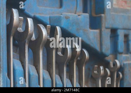 Set of wrenches in different sizes in a blue box. Copy space. Concept of car mechanich tools, industrial. Stock Photo