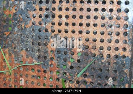 Rusted grill grate with holes - texture close up Stock Photo