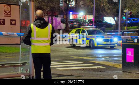 Glasgow, Scotland, UK 6th January, 2023.  Great western road was closed in easterly direction at blairdardie school bus stop as the busy bus route saw a traffic incident involving a car and pedestrian a large area was taped off for forensics.. Credit Gerard Ferry/Alamy Live News Stock Photo