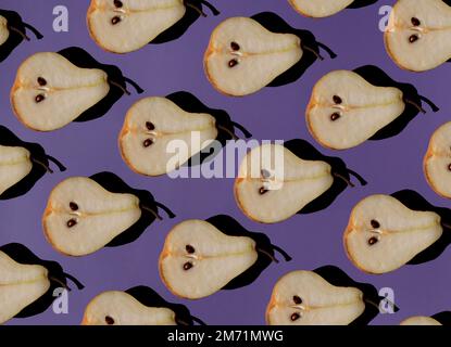 seamless pattern of fresh half of pear with shadow on purple background  Stock Photo