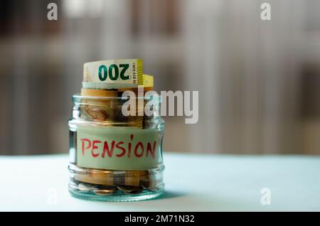 Concept of pension. Fall  reduction pension payments. Retirement. Financing retirees. Reduction of the pension fund. The low size of pensions. Poverty Stock Photo