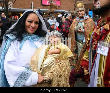 New York, USA. 6th Jan, 2023. Participants dressed up as the Virgin Mary carrying baby Jesus next to Joseph and in front of Balthasar the Wise Man march through the streets in East Harlem during the 46th annual Three Kings Day Parade organized by El Museo del Bario. The traditional Spanish celebration was held in person for the first time since the start of the coronavirus (COVID-19) pandemic. The theme for this year was: 'Entre Familia: Mental Health & Wellness of our Communities' focusing on the importance of mental health and wellness. Credit: Enrique Shore/Alamy Live News Stock Photo