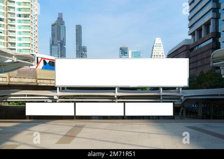 White wrinkled poster template in city. Glued paper mockup. Blank wheat paste on textured wall. Empty street art sticker mock up. Stock Photo