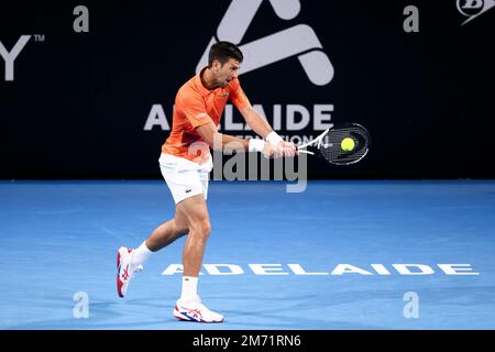 Adelaide, Australia, 6 January, 2023. Novak Djokovic of Serbia plays a backhand during the Adelaide International tennis match between Novak Djokovic of Serbia and Denis Shapovalov of Canada at Memorial Drive on January 06, 2023 in Adelaide, Australia. Credit: Peter Mundy/Speed Media/Alamy Live News Stock Photo