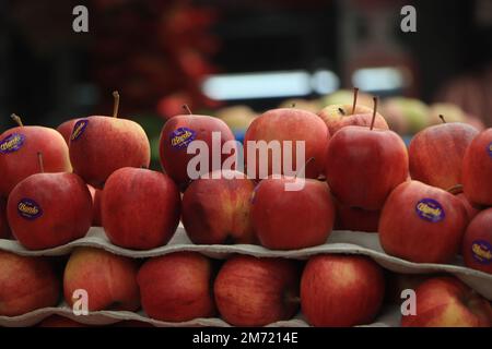 Yummy pile of apples in a market stall Stock Photo