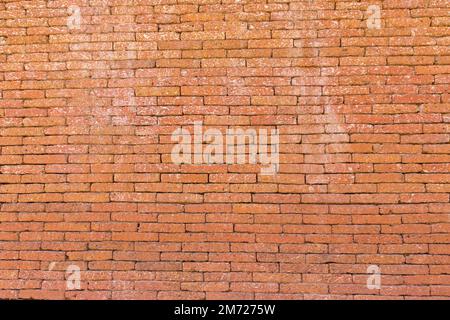 Red brick wall made of stone, Brick wall background. Stock Photo