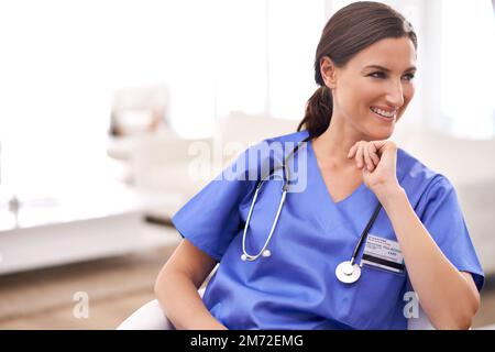 Happy to heal. a smiling medical practitioner in scrubs. Stock Photo