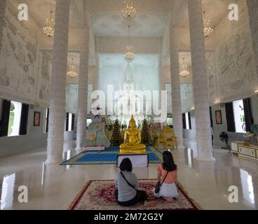 Chiang Rai, Thailand. November 17, 2022.People praying inside Wat Huay Pla Kang, known as Big Buddha temple Stock Photo