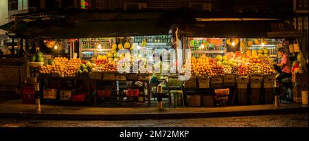 Hi-resolution  panorama of a fruit and drinks stall at night in Sai Kung, New Territories, Hong Kong (71Mpx) Stock Photo