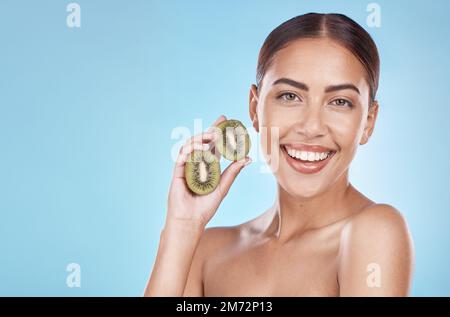 Skincare, kiwi and portrait of beauty woman with natural smile and healthy glow for marketing. Wellness, happy and self care model with fruit for Stock Photo