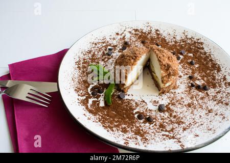 Delicious mole cake,homemade cake with banana cream, close-up. Stock Photo