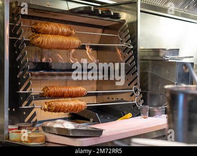 Turkish Street Flavors Kokorec Made From Cooked Sheep Intestines. Grilled Turkish street food Kokorec. Stock Photo