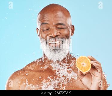 Lemon, water splash and senior man for skincare health, vegan product or cosmetics advertising, marketing or promotion mockup. Beauty african model Stock Photo