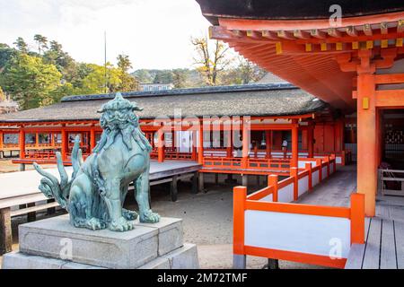 the bronze lion statue in  Itsukushima Shrine. A Shinto shrine on the island of Itsukushima Japan (popularly known as Miyajima). Stock Photo