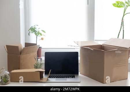 Shopping online e-comerce, Parcel boxes on a laptop. Stock Photo