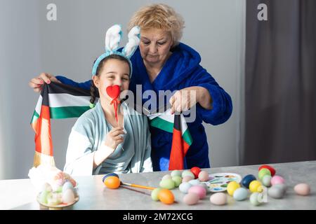 grandmother and granddaughter with uae flag for easter Stock Photo