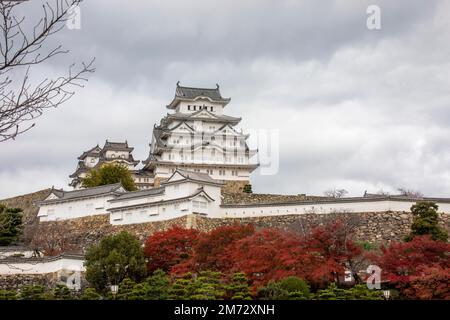 The view of Himeji Castle in autumn, a hilltop Japanese castle complex. It is located in the Hyogo Prefecture of Japan,  one of the first UNESCO Stock Photo