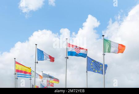 Brussels, Brussels-Capital Region, Belgium 20-08-2021. A number of flags of the European Union on a background of blue sky and clouds. clear wether Stock Photo