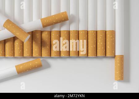 what happens if you smoke 10 cigarettes in a row Many cigarettes in a row on a white background. close-up Stock Photo