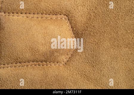 Leather suede stitches details, abstract backdrop, soft focus macro Stock Photo