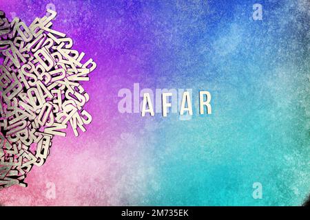 AFAR in wooden English language capital letters spilling from a pile of ...