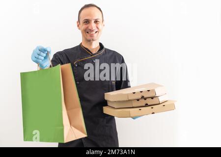 Delivery man with boxes of pizza, chef. Stock Photo