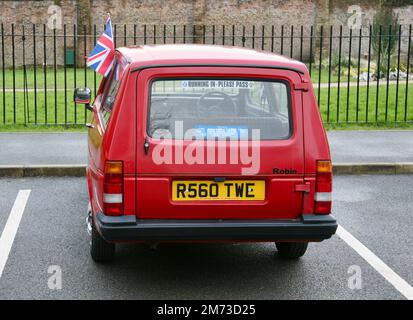 A close up view of a classic red Reliant Robin three-wheeler vehicle, Astley Park, Chorley, Lancashire, United Kingdom, Europe Stock Photo