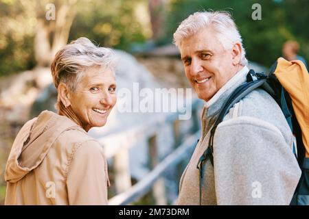 Portrait, hiking or couple of senior friends in nature trekking, walking or hiking for peace or freedom. Travel adventure, partnership or happy Stock Photo