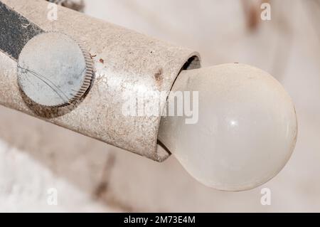 old lightbulb, vintage bulb holder, real electrical installation Stock Photo