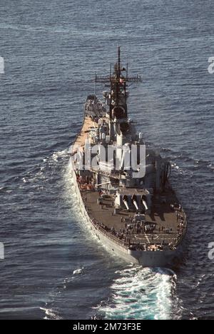 An aerial stern view of the battleship USS Missouri (BB 63) underway, July 1986
