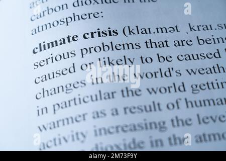 A mock up of a dictionary page with the word climate crisis with selective focussing Stock Photo