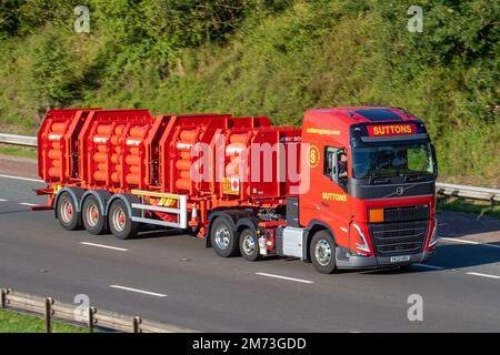 SUTTONS GROUP 2022 red Volvo 12777 cc  HGV transporting BOC Gases on the M6 motorway, UK Stock Photo