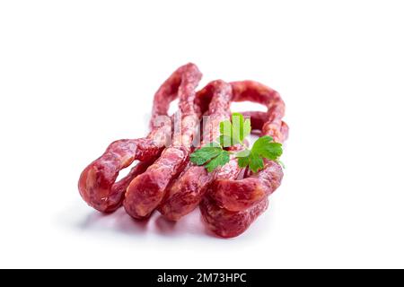 Dry cured  Kabanos sausage isolated on white Stock Photo