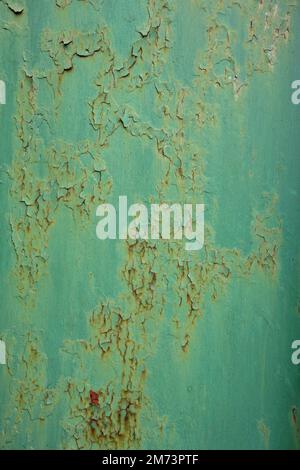 Background of metal surface with rusty cracks in its old green paint Stock Photo