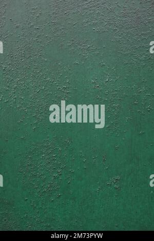 Background of metal surface covered with old green paint Stock Photo
