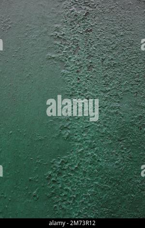 Background of metal surface covered with old green paint Stock Photo