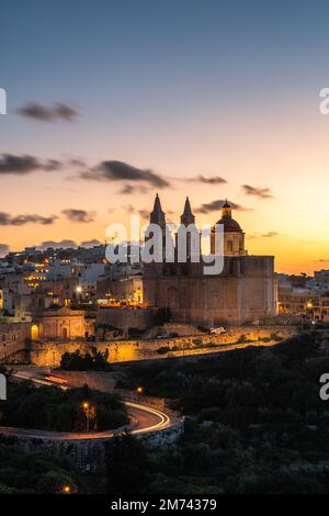 Il-Mellieha, Malta, skyline view of Mellieha town after sunset with Paris Church. Stock Photo