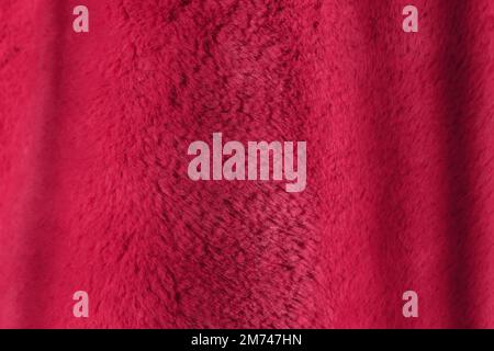 Red background of plush fabric, Viva Magenta color Stock Photo