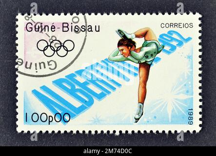 Cancelled postage stamp printed by Guinea Bissau, that shows Figure skating, Winter Olympic Games 1992 - Albertville, circa 1989. Stock Photo
