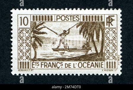 1934-1939 issue 10 Franc French Oceania postage stamp depicting a spear fisherman. French Oceania was renamed French Polynesia in 1958. Stock Photo