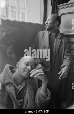 London. Late 1960s. Two friends socialising in The Duke of Wellington pub, situated on the corner of Portobello Road and Elgin Crescent in the Notting Hill district of the Royal Borough of Kensington and Chelsea, West London. Stock Photo