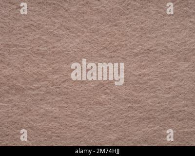 Natural dark beige or soft brown felt, velvet texture. Soft background for text, lettering, patchwork or other art work. Full frame backdrop pattern Stock Photo