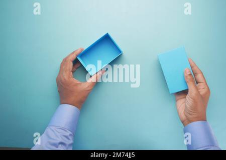 top view of person open a empty small gift box  Stock Photo